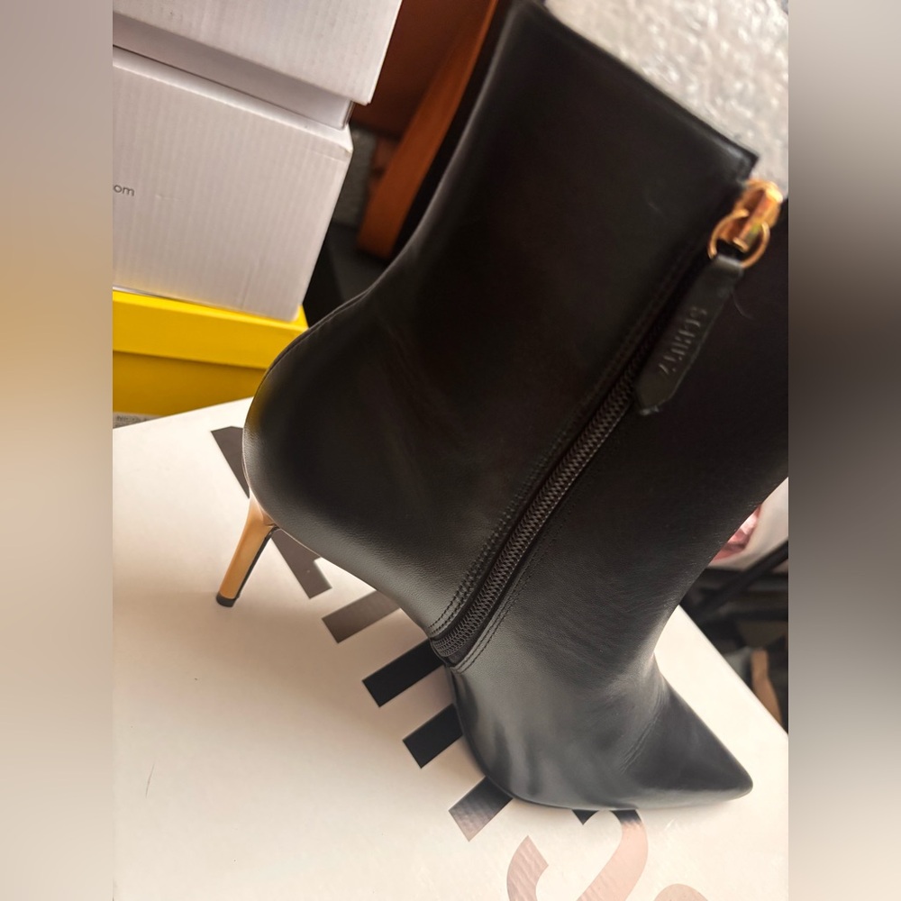 Brand new stiletto boot. Gold heel.